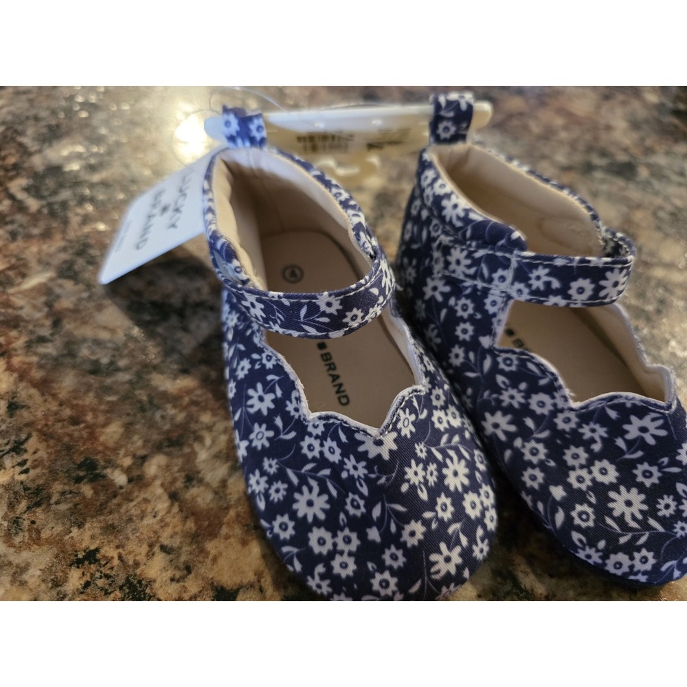Lucky Brand. Size 4 baby girl slip on shoes. Blue and
